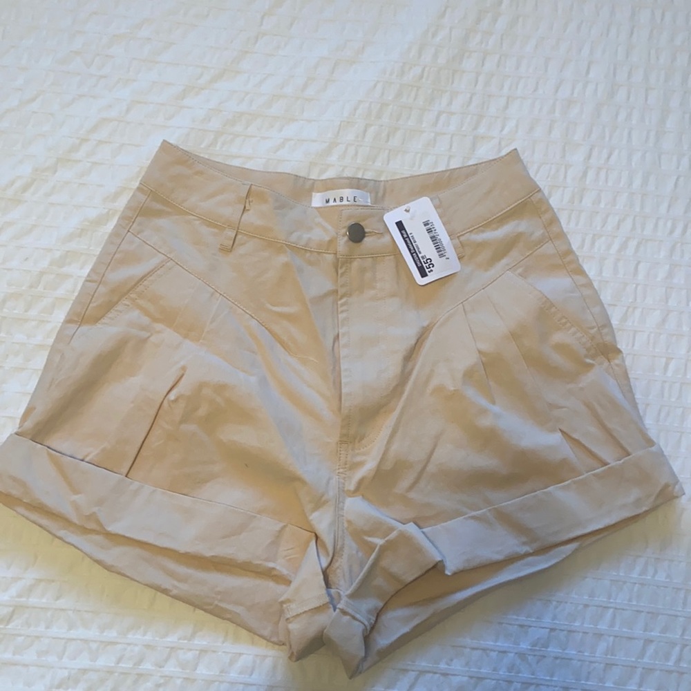 Light cream colored high waisted dressy shorts. Never worn. With tag.
